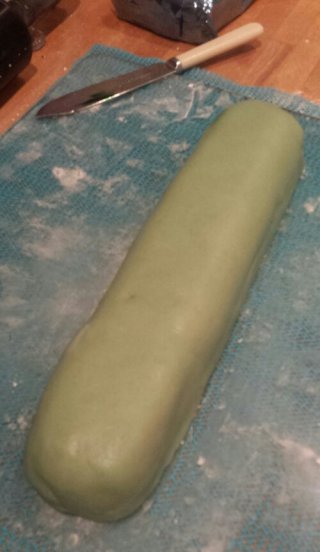 One chocolate cake sausage encased in marzipan